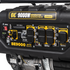 BE9000 generator control panel close-up showing outlets, CO alert, AVR, LED light, engine switch, and breakers