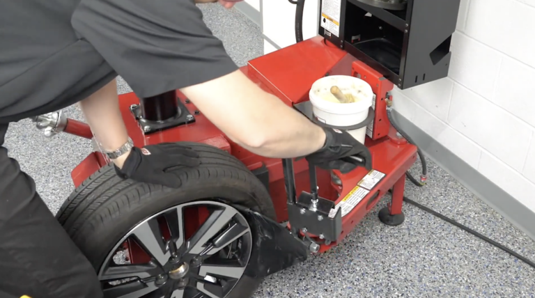 Coats 90C bead breaking demonstration with technician and alloy wheel