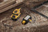 Dewalt DCL182 LED Task Light being charged via USB cable on workshop surface