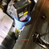 9 Circle blue oil funnel in use adding motor oil to engine via filler neck