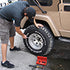Person using Access Tools Easy Off socket set on a Jeep wheel and tire