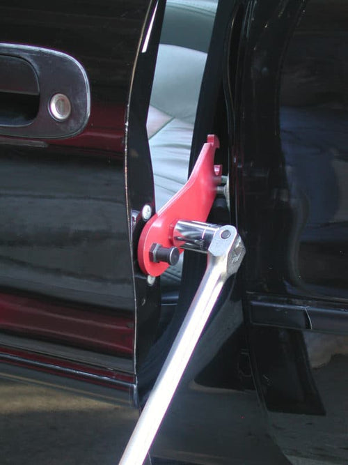 Milton Industries 21845 E-Z Store Door Alignment Bar in use on car door hinge with breaker bar