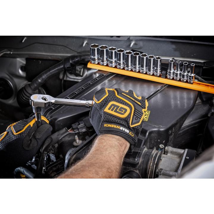 Gearwrench 120XP ratchet being used in an engine bay with socket rail in background