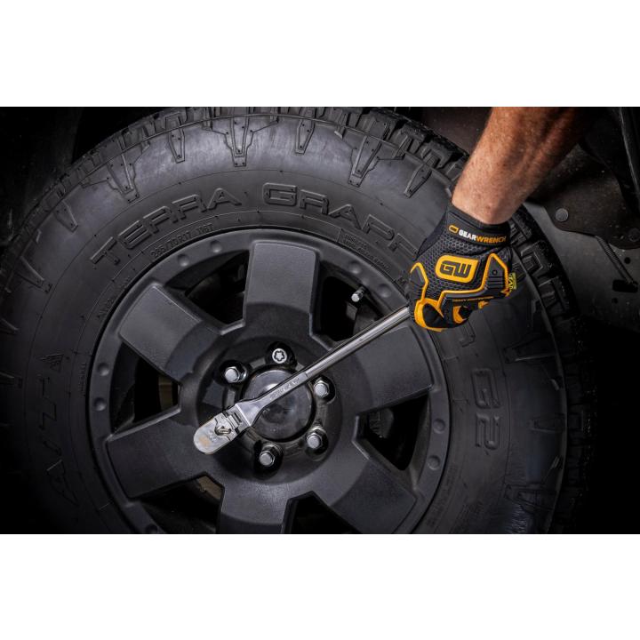 Gearwrench 81306XP Flex Head Ratchet in use on vehicle wheel lug nuts - lifestyle shot