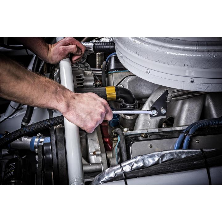 Mechanic using a Gearwrench long pattern combination wrench in a tight engine bay
