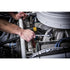 Mechanic using a Gearwrench long pattern combination wrench in a tight engine bay