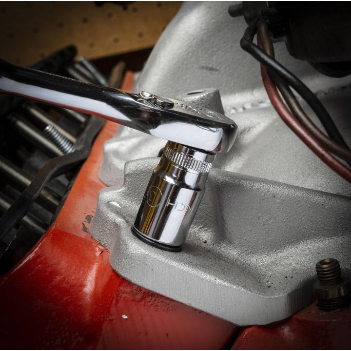 Gearwrench Chrome Socket in use with ratchet on engine block