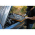 Mechanic using Gearwrench GWGMTK184 tool kit on a vehicle engine bay outdoors