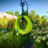 Flexzilla 50 ft. garden hose coiled on hose hanger mounted on garden post in outdoor setting