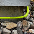 Flexzilla garden hose bending around concrete structure demonstrating extreme all-weather flexibility