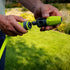 Close-up of Flexzilla quick connect coupler being attached to twist action nozzle outdoors