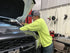 Alert Stamping 5030AM LED Work Light lifestyle shot - mechanic using retractable cord reel in garage