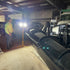 Alert Stamping LF240ST ProLite Twin LED Tripod Flood Light illuminating garage work area at night