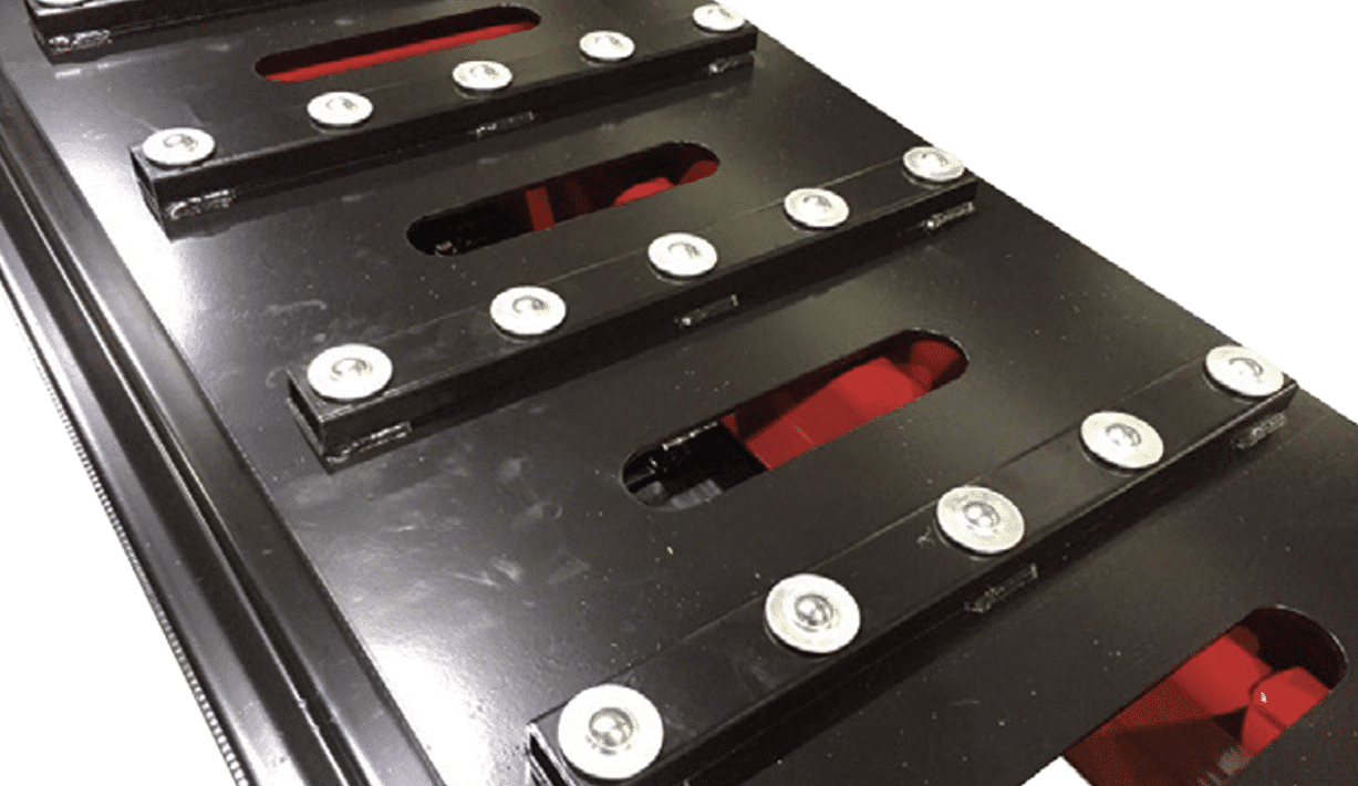 Close-up of open runway slots on the Coats 14K scissor lift service deck