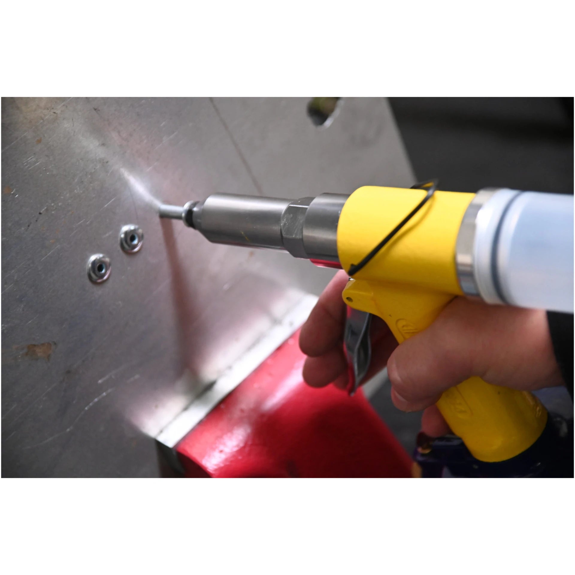 Astro Pneumatic PR14 Air Riveter being operated on sheet metal close-up