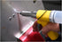 Astro Pneumatic PR14 Air Riveter in use setting a rivet on sheet metal panel