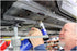 Astro Pneumatic PRN1 pneumatic rivet nut setter being used on vehicle undercarriage in shop
