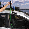 Access Tools Button Master being used to pull up a vertical door button on a car
