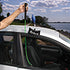 Access Tools Button Master being used to pull up a vertical door button on a car