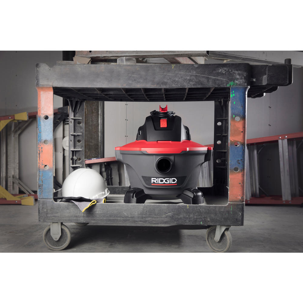 Ridgid 62698 RT0600 Wet/Dry Vac stored on a job site utility cart