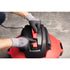 Close-up of Ridgid RT0600 motor head latch mechanism being operated with gloved hands