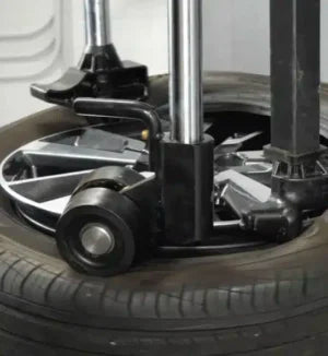 RoboRoller bead pressing arm in operation on Coats Maxx 80 Tire Changer