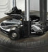 RoboRoller bead pressing system in use on tire with Coats Maxx 80 Tire Changer