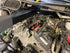 Steck STC50133 ENGINEOUT Engine Lift Plate shown in Ford vehicle engine bay ready for use