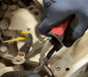 Lisle 11410 Cable Stripping Knife being used in tight automotive engine compartment