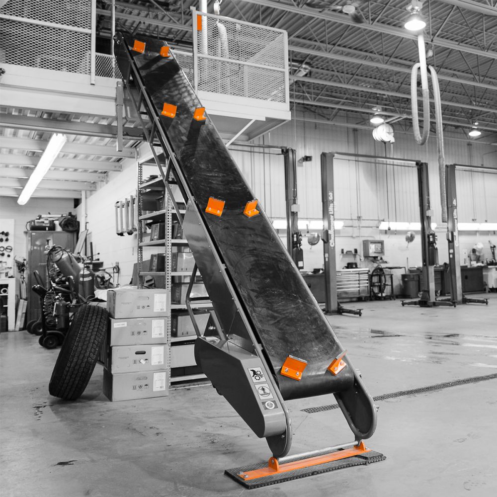 Martins Industries TC-15 15' Tire Conveyor installed in a tire shop, lifestyle environment shot