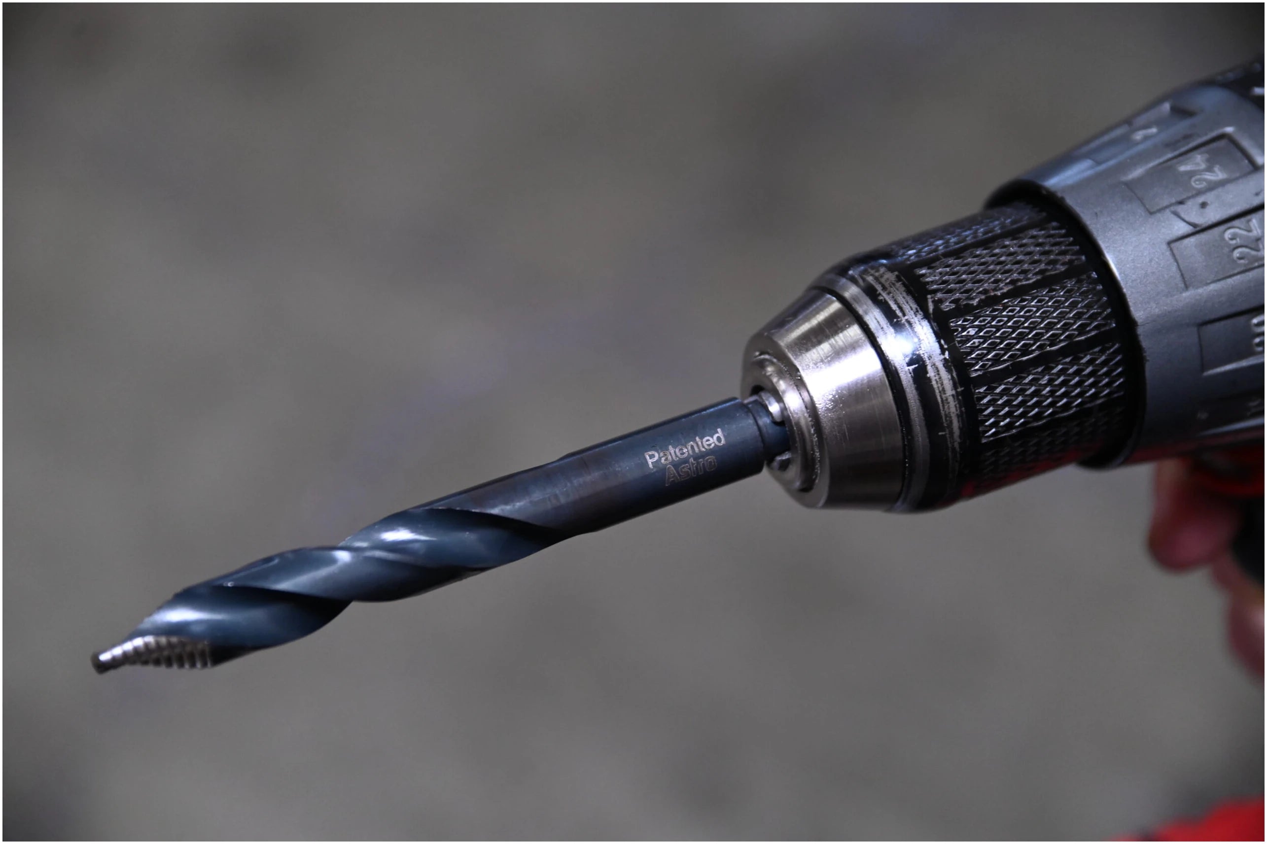 Astro Pneumatic TurboStep patented drill bit mounted in drill chuck - side profile view