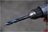 Astro Pneumatic TurboStep patented drill bit mounted in drill chuck - side profile view