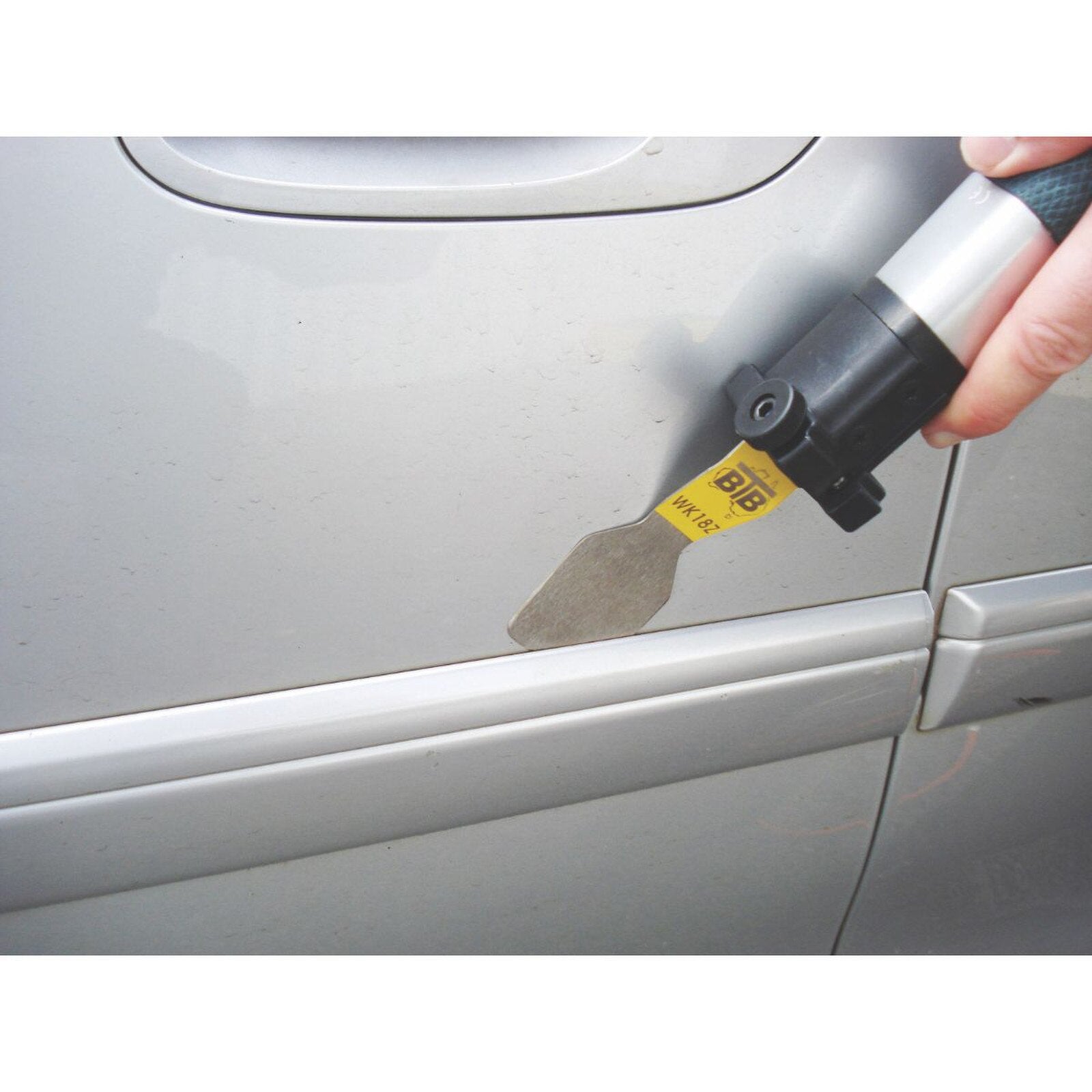 Equalizer BTB WK10HD Air Tool with blade removing emblem from a car door panel