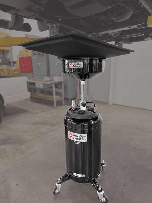 JohnDow Industries JD-2436 Big Mouth Transmission Drain Pan in use under vehicle in service bay