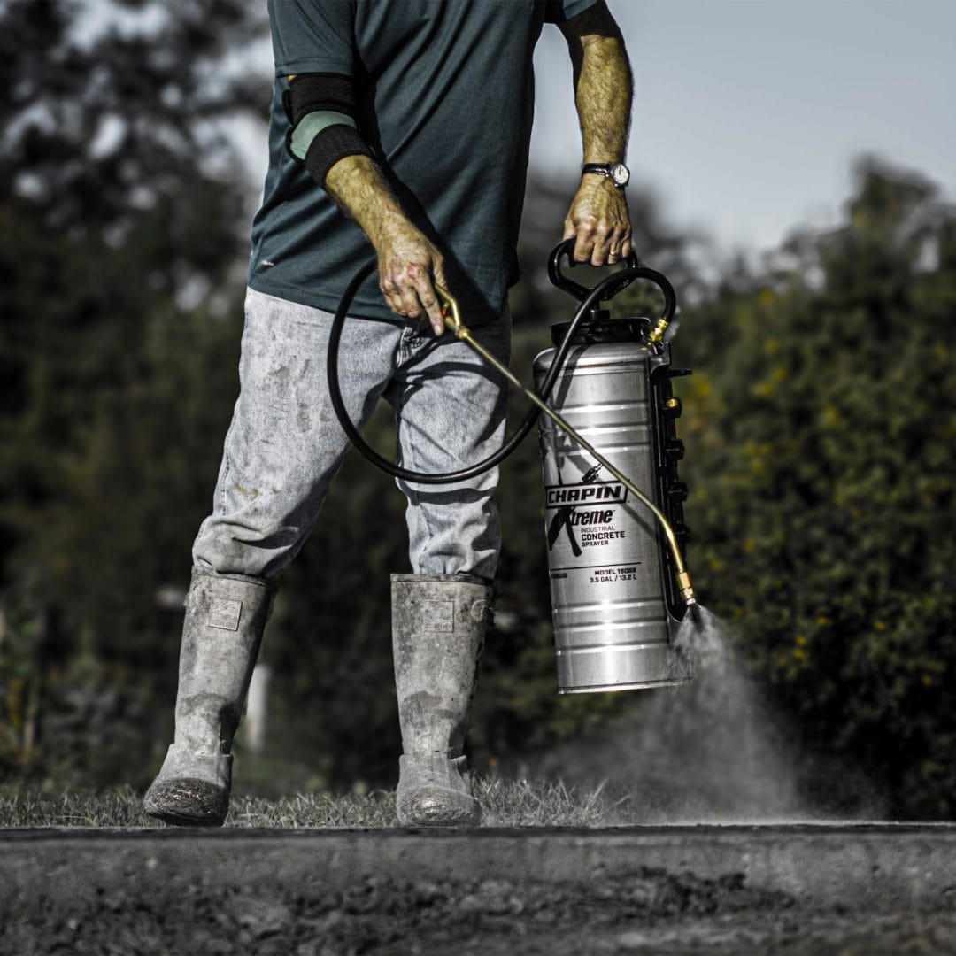 Worker using Chapin 19069 Xtreme Concrete Sprayer for concrete curing application