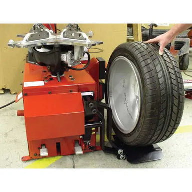 Coats 85608609 Point-of-Use Lift System in use supporting tire and wheel assembly