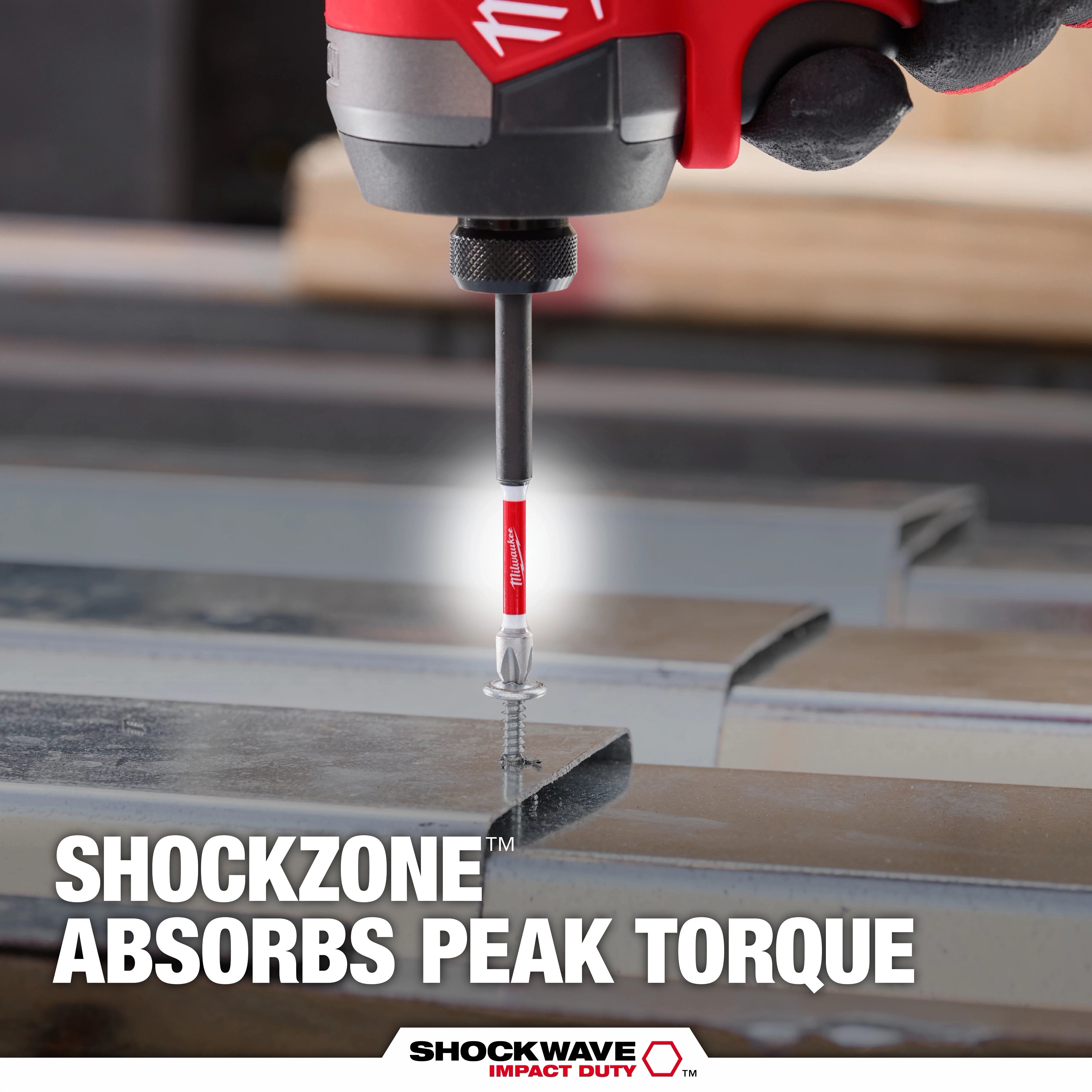 Milwaukee SHOCKWAVE Impact Duty bit in action driving a screw into metal - SHOCKZONE absorbs peak torque