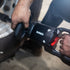 Sunex Tools SX01026 Magnesium Composite Impact Wrench being operated on vehicle axle in shop environment