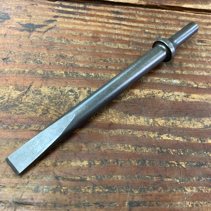 Ajax Tool Works A910-1/2 1/2 Inch Zip Gun Flat Chisel on wooden surface
