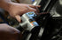 Astro Pneumatic AST-3036 Air Belt Sander in use on automotive panel - close-up