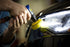 Astro Pneumatic mini air polisher in use buffing automotive headlight panel