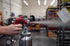 Astro Pneumatic 4008 Red Handle Spray Gun being operated in a workshop environment