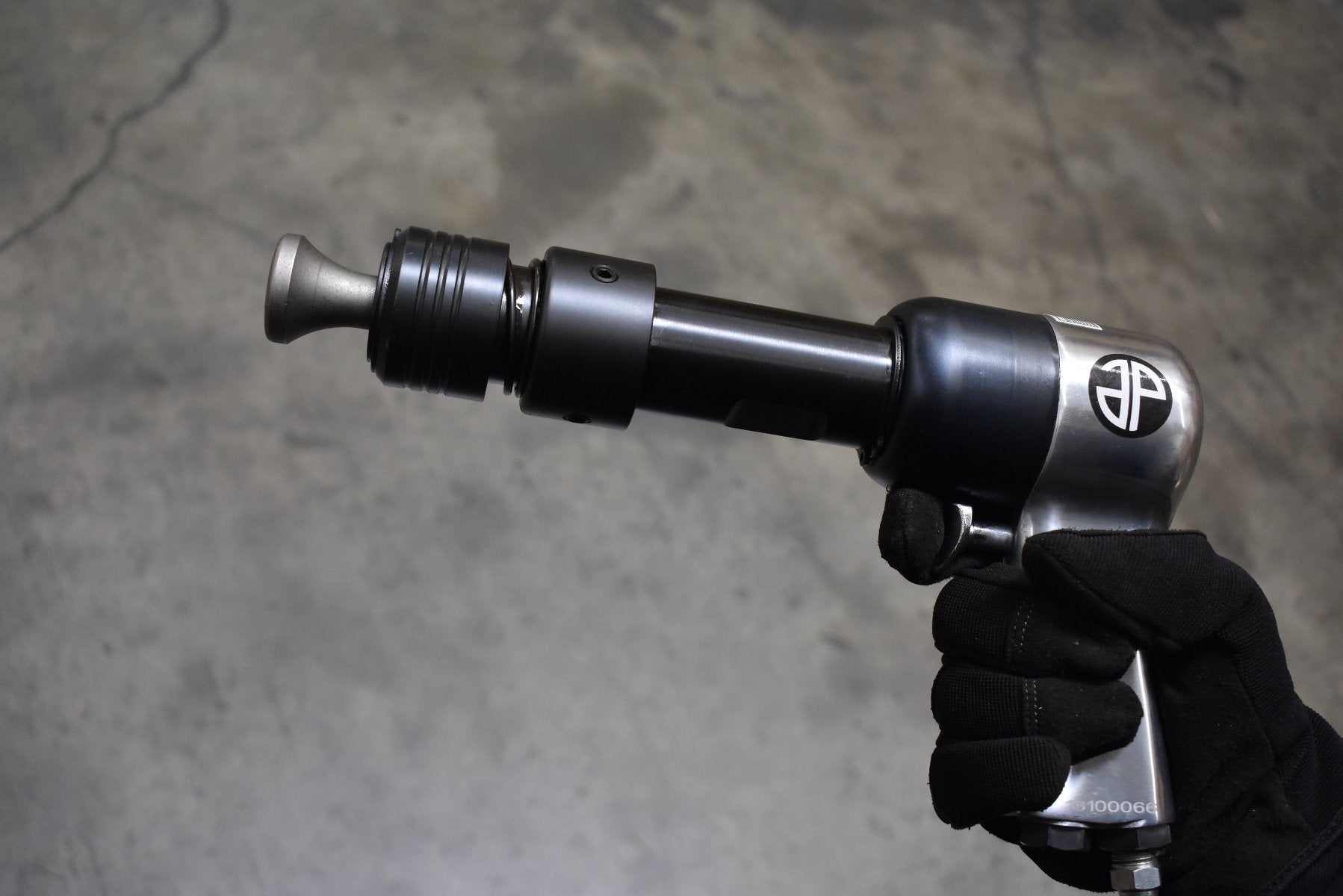 Astro Pneumatic 49801 Quick Change Retainer Chuck installed on air hammer in use