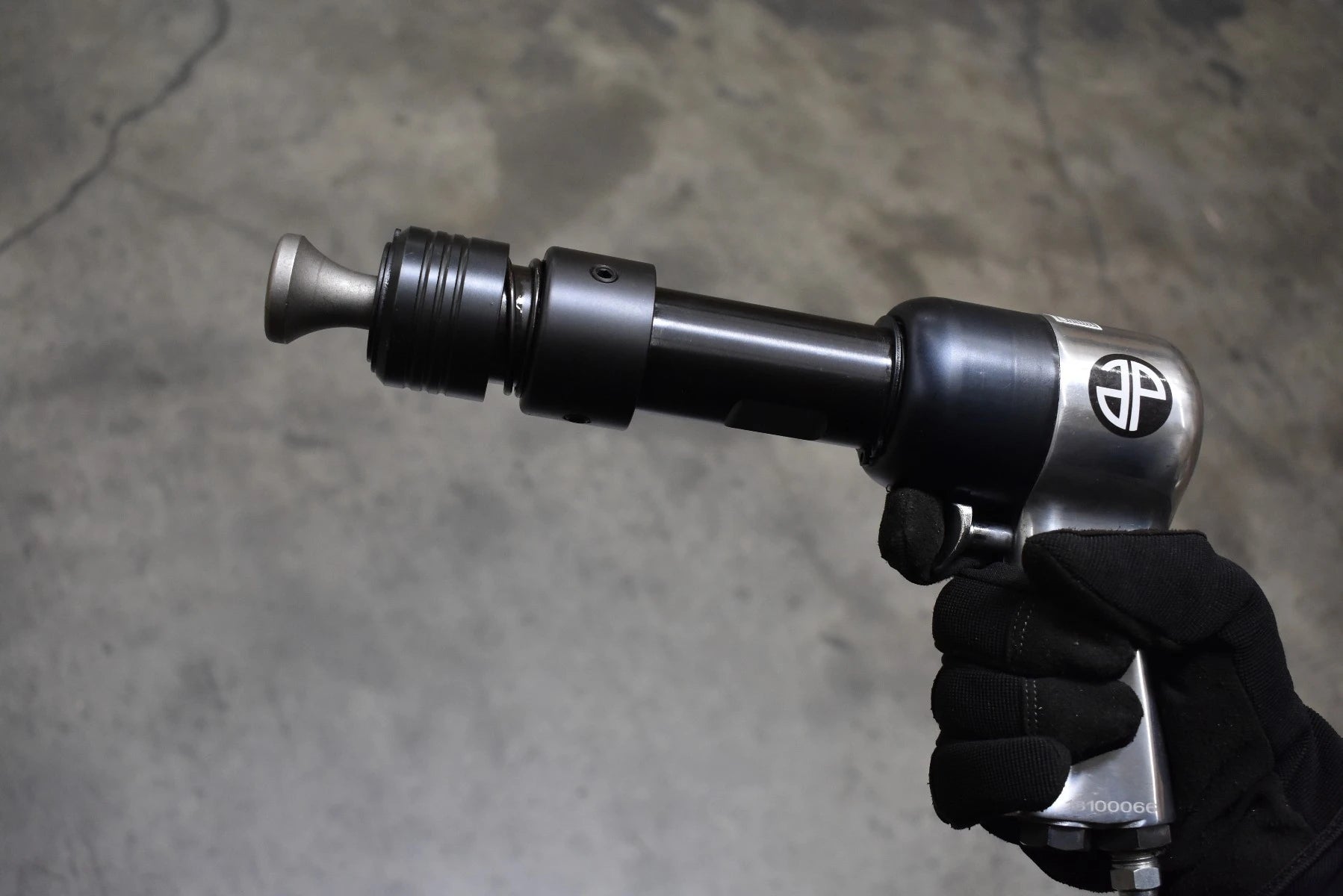 Astro Pneumatic 49803 Chisel & Hammer Bit Set in use on air hammer - close up