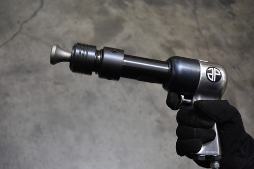 Astro Pneumatic 49803 Chisel & Hammer Bit Set in use on air hammer - close up