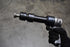 Astro Pneumatic 49803 Chisel & Hammer Bit Set in use on air hammer - close up