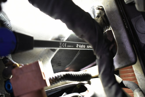 Astro Pneumatic 52SL LED Slim Light in use illuminating vehicle engine bay components from underneath