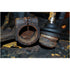 Close-up of rusted Subaru ball joint and housing separated after extraction