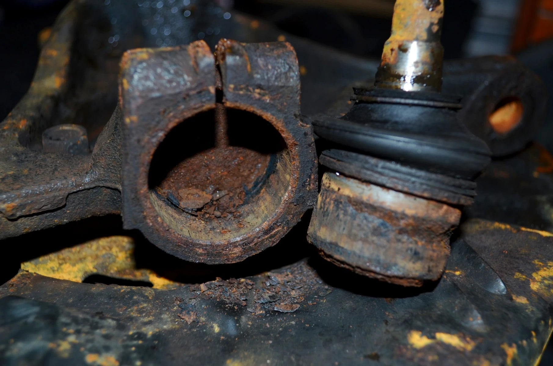 Severely rusted and corroded Subaru ball joint housing after removal with 78620 puller