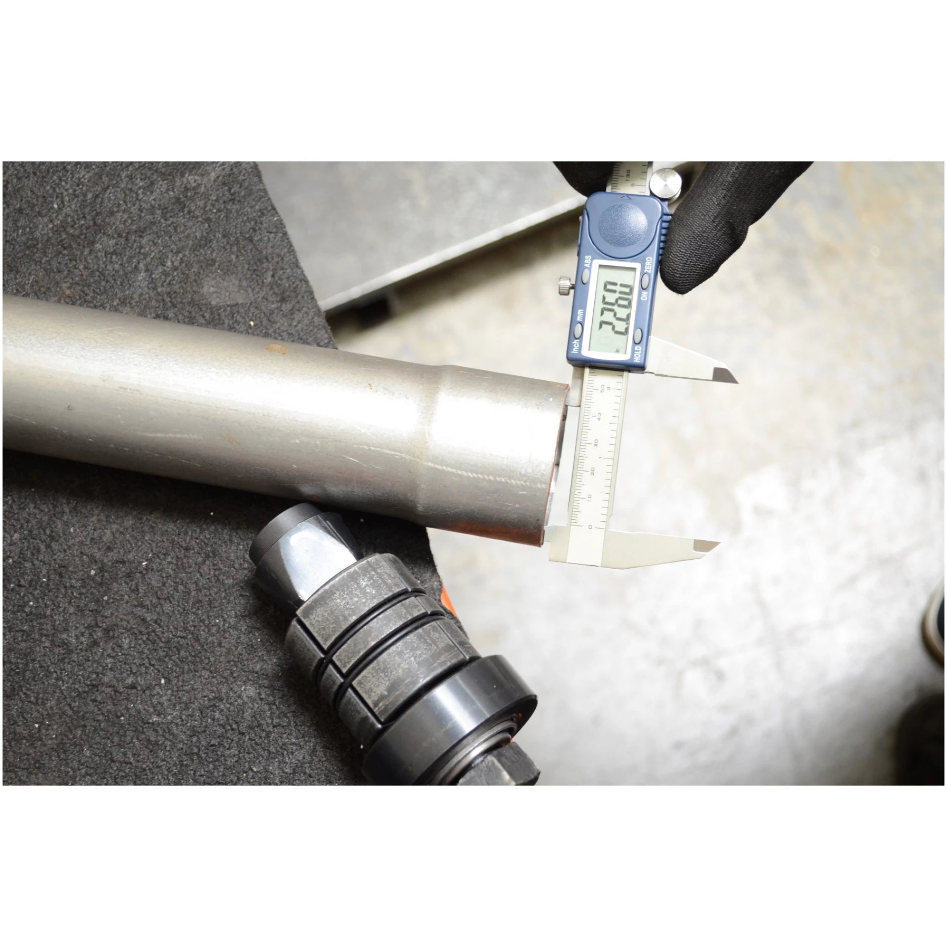 Astro Pneumatic 78835 expander collet and exhaust pipe measured with digital calipers close-up